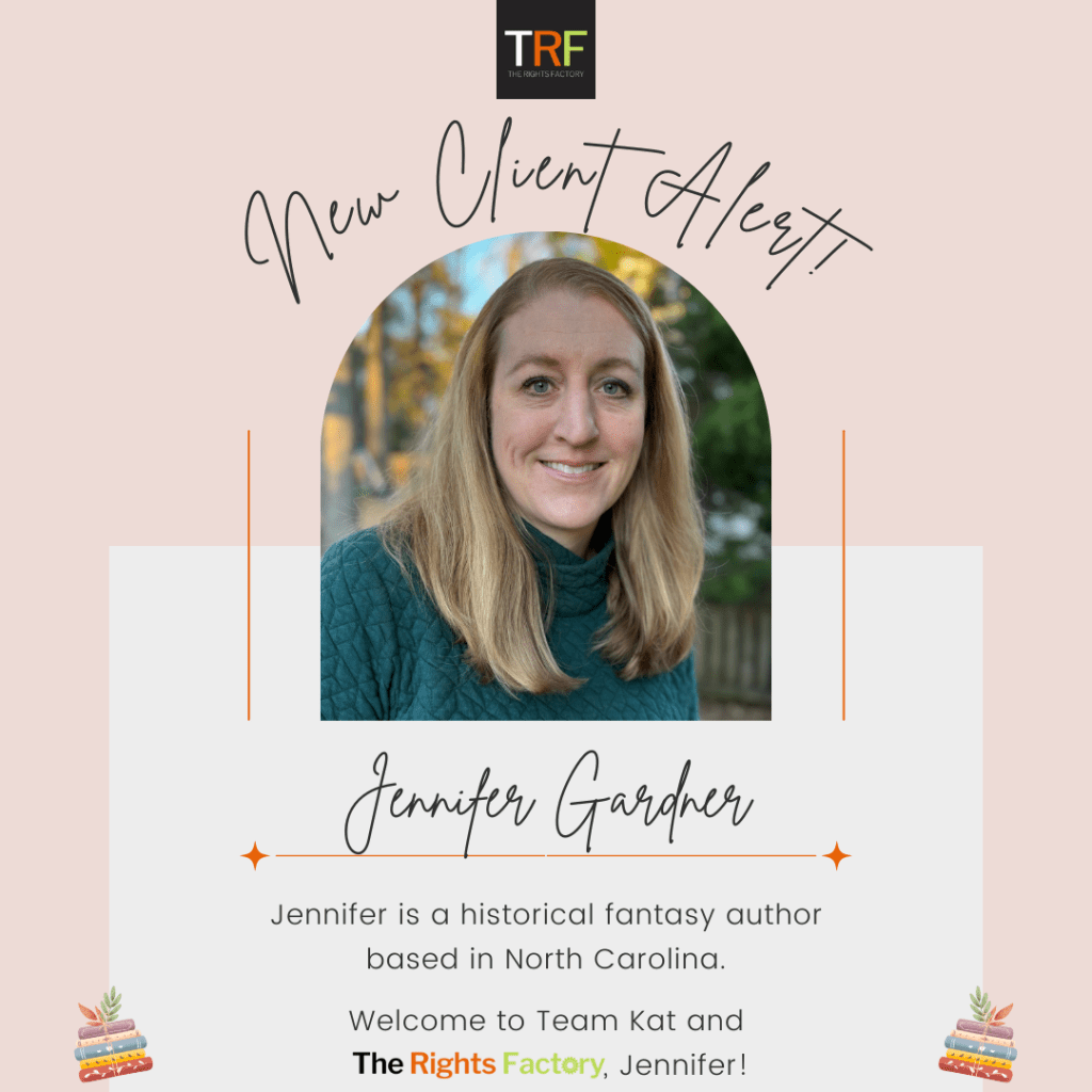 A peachy-coloured background. The Rights Factory logo at the top middle (small black square with TRF letters in white, red, and neon green).
Curved Handwriting text:
New Client Alert!
A photo of Jennifer in the middle, a light-skinned woman with medium-length blonde hair and blue eyes. She is smiling with teeth and wearing a dark teal/green sweater, standing outside with a background of blurred trees and blue sky with late afternoon sun hitting the trees. Text:
Handwriting, Jennifer Gardner.
Regular font, Jennifer is a historical fiction author based in North Carolina.
Welcome to Team Kat and The Rights Factory, Jennifer!
A small graphic of colourful stacks of books is on either side, tilted inward, at the bottom.