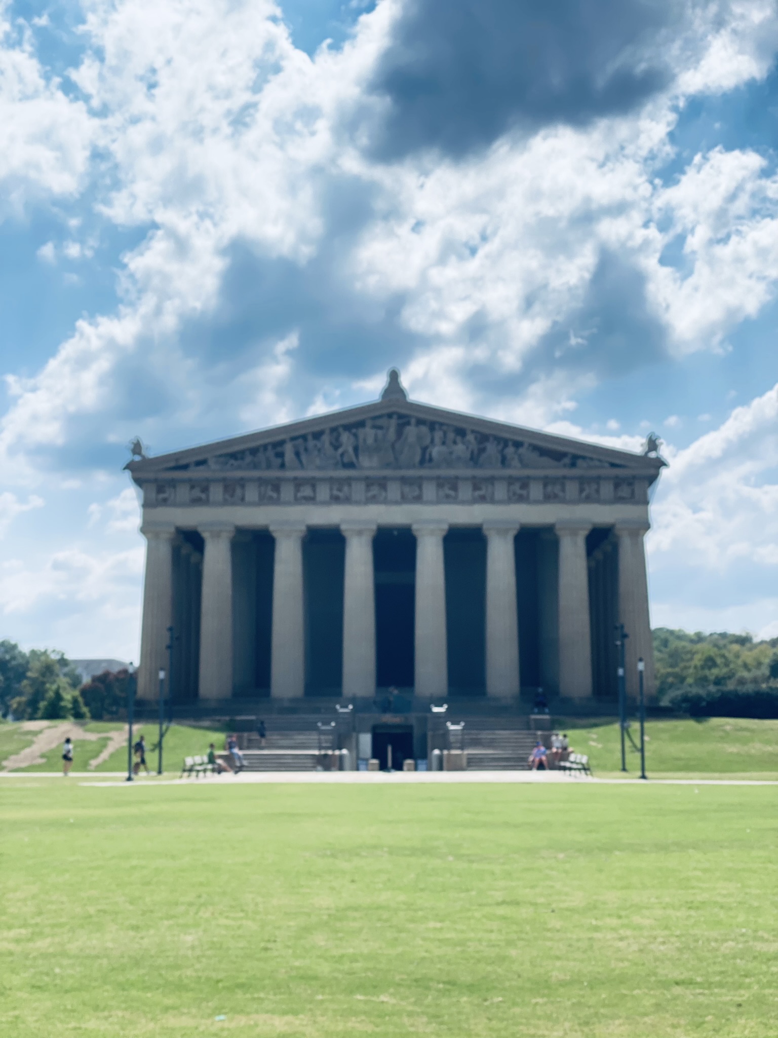 A large Greek style building, exact replica of the columned Parthenon.